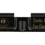 Close-up of a camera flash unit with a smiley icon and the phrase 'Smile, Wait For Flash!'