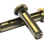 Crossed metal rods forming a small handheld tool with a knurled adjustment knob on top and hollow ends.