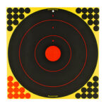 A square yellow target board with large black bullseye rings and a red center, plus clustered black and red holes in the corners indicating hits.