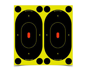 Two black oval shooting targets with orange centers mounted on a bright yellow backing.