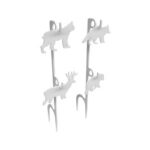 Abstract sculpture of four gray dog silhouettes perched on vertical posts.