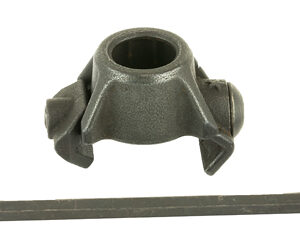 Metal clamp with a circular bore and mounting tabs, shown with a long hex key beside it.
