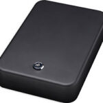 Small black rectangular safe with a round combination dial on the front.