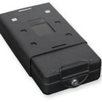 Black rectangular rechargeable battery pack with a metal latch on the front and mounting slots on top.