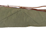 Green canvas shotgun case with brown leather ends, an adjustable strap, and a side pocket for accessories
