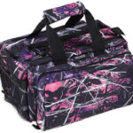 Purple and pink graffiti-patterned duffel bag with black handles and multiple zip pockets.
