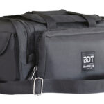 Black rectangular tool bag with multiple zip pockets, a front pouch, and an adjustable shoulder strap with metal hardware.
