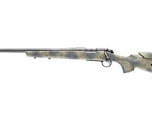 Bolt-action rifle with long steel barrel and wooden stock shown in profile, with bolt and trigger guard visible.