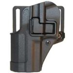 Black polymer outside-the-waistband handgun holster with retention strap and belt clip.