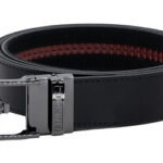 Black leather belt with a shiny silver buckle, lightly coiled on a white background.