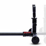 Camera slider dolly rig on a long black rail with two vertical supports on each end