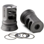 Two gray metal cylindrical valve-like parts with holes, shown with several circular washers (shim rings) beside them — a small hardware kit.