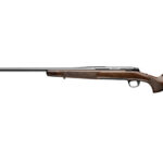Bolt-action rifle with wooden stock and long barrel, shown in profile.