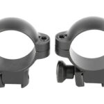 Pair of black rifle scope rings with mounting bases for securing a telescope-style sight on a firearm.