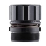 Close-up of a metal cylindrical vape atomizer with threading at the bottom and a coil-like ring around the middle, showing its top and bottom sections.