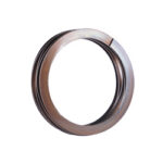 Bronze-colored circular metal ring with a hollow center, viewed from the side.