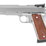 Side view of a silver semi-automatic pistol with a wooden grip and iron sights on a white background.