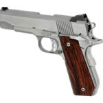 Semi-automatic pistol with a stainless finish and brown wooden grip, shown in side view