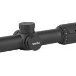 Black riflescope with elevation turret and magnification dial, lens caps visible; used for precision aiming in shooting.