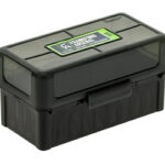 Black plastic toolbox with a latch and a green label on the lid