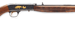 Bolt-action rifle with wooden stock and metal barrel shown on white background.