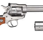Single-action revolver with a wooden grip and long barrel, shown beside a detachable speedloader.