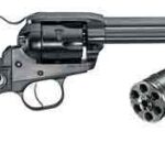 Six-shot revolver pistol with an exposed cylinder and a separate extra cylinder beside it.