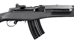 AK-47–style assault rifle with black stock and curved magazine, shown in profile on a white background.