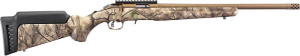 Camouflage-pattern bolt-action hunting rifle with a synthetic stock and long beige barrel with a muzzle brake on a white background