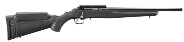 Side view of a black bolt-action rifle with adjustable stock and scope rail on top shelf railing the barrel's length impact.