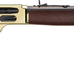 Lever-action rifle with wooden stock and brass-colored receiver on a white background.