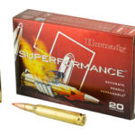 Box of Hornady Superformance ammunition with two bullets beside it (20 cartridges total).​