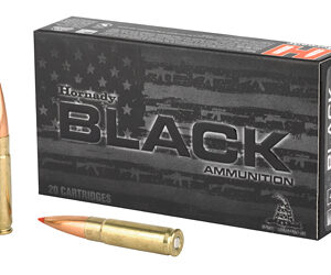 Box of Hornady Black ammunition with two rifle cartridges, one upright and one lying next to the box.