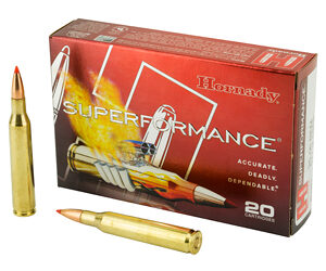 Box of Hornady Superformance ammunition with two brass bullets beside it.