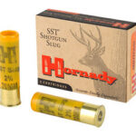 Two yellow brass shotgun slug shells with a Hornady SST Shotgun Slug box beside them