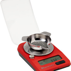 Red digital precision scale with a metal weighing dish and sieve, display showing 33.3 g, lid open behind it