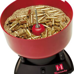 Red Hornady reloading tumbler filled with brass cartridge cases and polishing media.