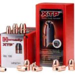 Red packaging labeled XTP ammunition with copper bullets scattered around
