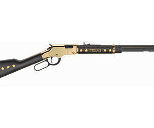 Decorative lever-action rifle with a black and gold finish and star motif, featuring the word Texas along the barrel