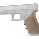 Semi-automatic pistol with a tan textured grip, shown in side profile