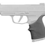 Side view of a compact semi-automatic pistol with a black textured grip.