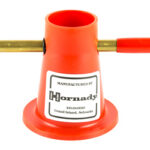 Orange Hornady reloading tool with two brass rods extending left and right; label reads 'Manufactured by Hornady'.