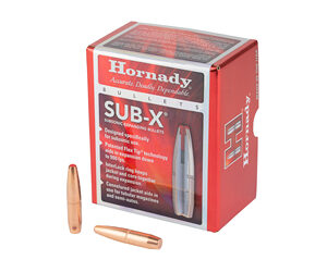Red Hornady Sub-X bullet box with two copper-colored bullets lying beside it.