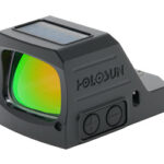 Holosun red-dot sight with solar panel on top, green lens, and mounting base for firearms