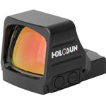 Holosun compact reflex red dot sight with orange-tinted lens on a white background
