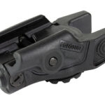 Close-up of a small black tactical optic with a lens and mounting rail for a firearm, used to aid aiming.