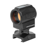 Compact red dot sight with mounting base for firearm rail.