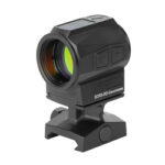 Compact black red-dot reflex sight with mounting base for a rail, used to aid aiming.