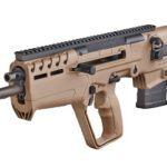 Left-side view of a tan assault rifle with a top Picatinny rail, foregrip, and curved magazine.