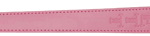 Pink strap with multiple adjustment holes and a metal snap at one end; appears to be a wearable belt or watch strap in pink.